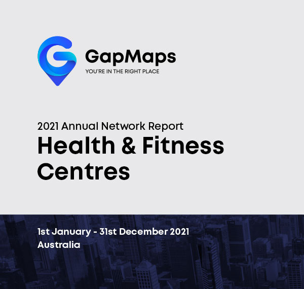 34--Network-Report-Fitness Young lady in the shopping centre holding mobile phone in the hand