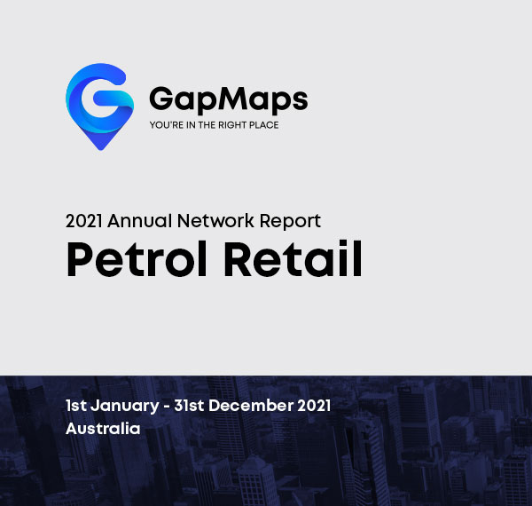 36--Network-Report-Petrol-Retail Young lady in the shopping centre holding mobile phone in the hand